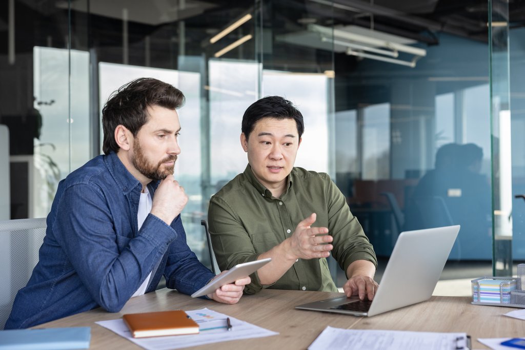A manager listening attentively while a colleague explains a plan, illustrating the Requestive Channel
